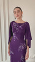 Purple column dress with cape sleeves